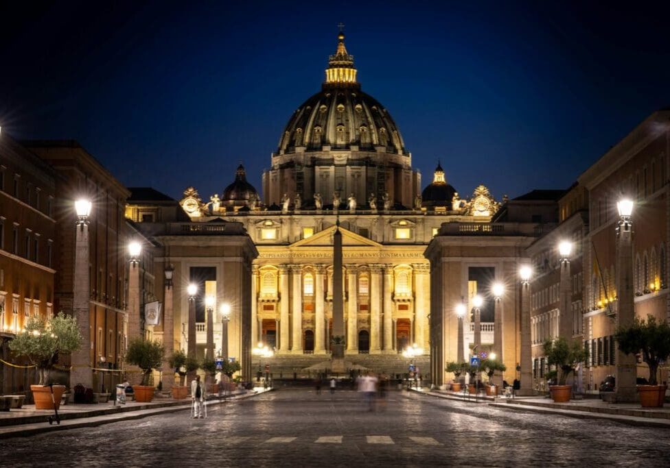 A large building with lights on the top of it.